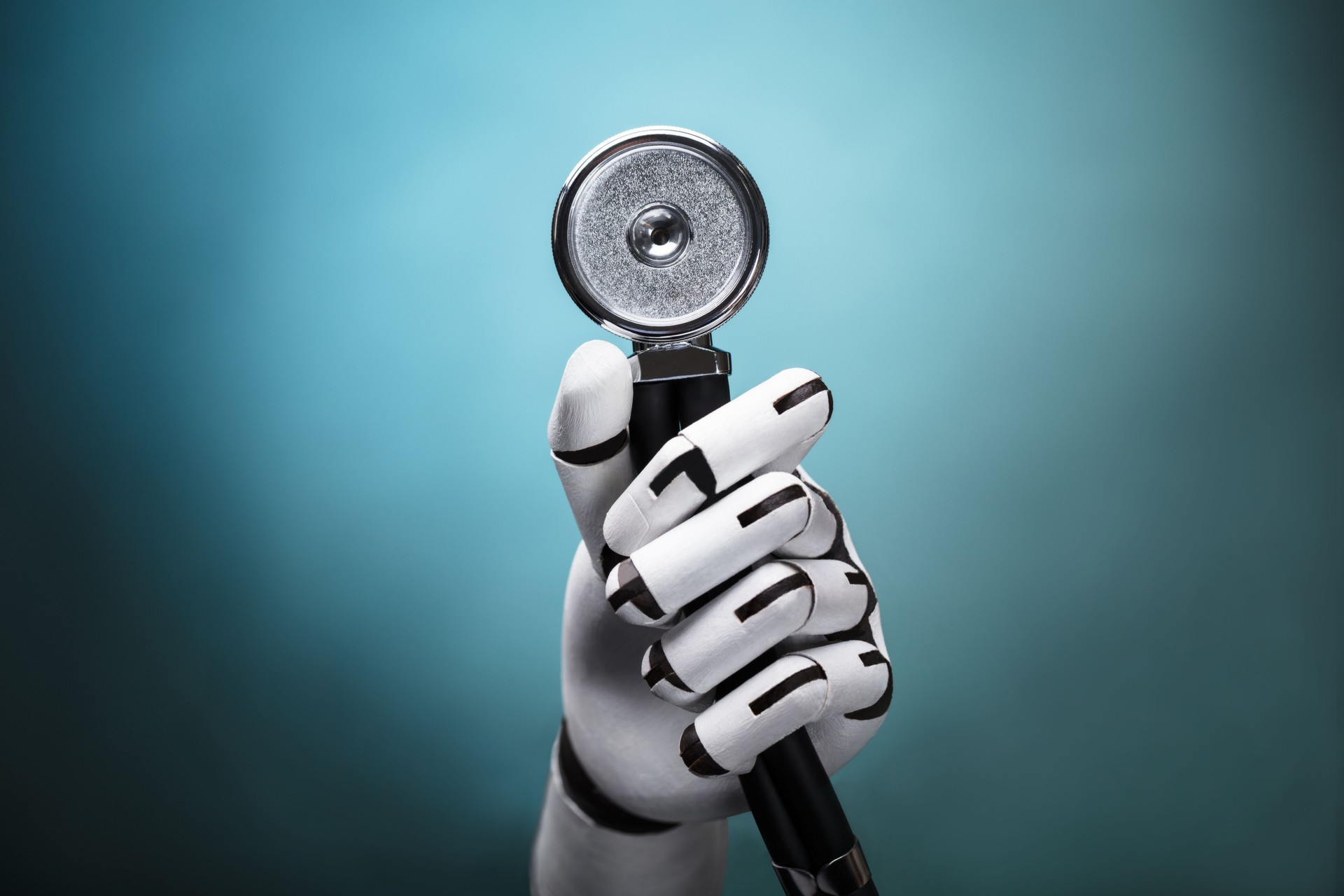 Close-up Of A Robot's Hand Holding Stethoscope